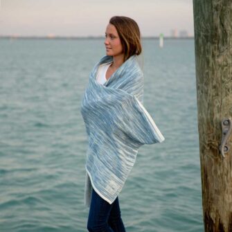 Swans Island Boothbay Wraps. Handwoven with a soft merino wool / silk blend. Made in Maine. Shown here in Ikat Indigo + Natural color,