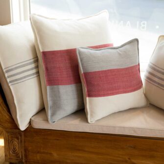 Swans Island Company's Maine Coast Pillows. Handwoven in Maine with soft hand-dyed organic merino wool. Shown in Winterberry.
