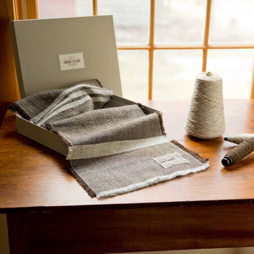 Swans Island Company - Island Collection Scarf in brown with natural grey stripes. Handwoven in Maine using single-origin wool from Long Cove Farm on Vinalhaven Island, Maine. Scarves come in a grey linen gift box.