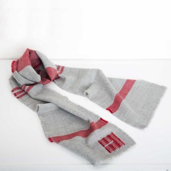 Swans Island Company - Island Collection Scarf in natural Grey with Winterberry stripes. Handwoven in Maine using single-origin wool from Long Cove Farm on Vinalhaven Island, Maine.