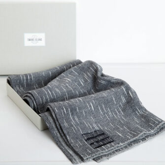 The Swans Island Firefly Wrap comes in our distinctive linen gift box.