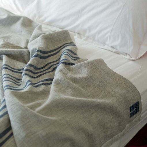Swans Island Heritage Blanket - handwoven in Maine 100% wool. Shown here in Grey with Indigo stripes.