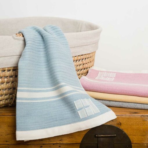 The Swans Island Modern Grace Baby Blanket is hand-dyed and handwoven in Maine with ultra-soft organic merino wool.