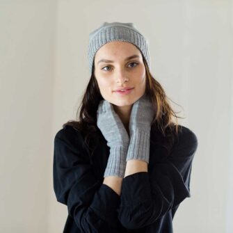 Swans Island Company's Bar Island Hat with matching Bar Island fingerless mitts. Knit with soft silk/merino wool. 100% made in USA with hand-dyed yarns. Shown here in Pewter.