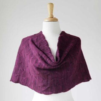 Swans Island Company's Cirrus Cowl is knit with shimmery hand-dyed silk and merino wool. Made in USA. Shown in Aubergine.