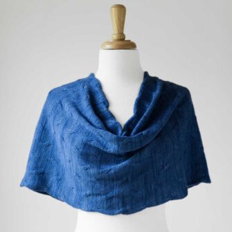 Swans Island Company's Cirrus Cowl is knit with shimmery hand-dyed silk and merino wool. Made in USA. Shown in Nautical Blue.