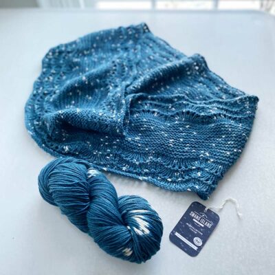 Swans Island's Anna Cowl knitting pattern shown in Firefly worsted weight organic merino hand-dyed yarn, Blue Spruce color.