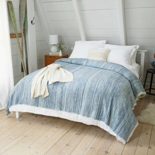 Swans Island Watercolors Blanket is handwoven and hand-dyed in Maine. 100% Organic merino wool blanket. Shown here in Indigo + Natural