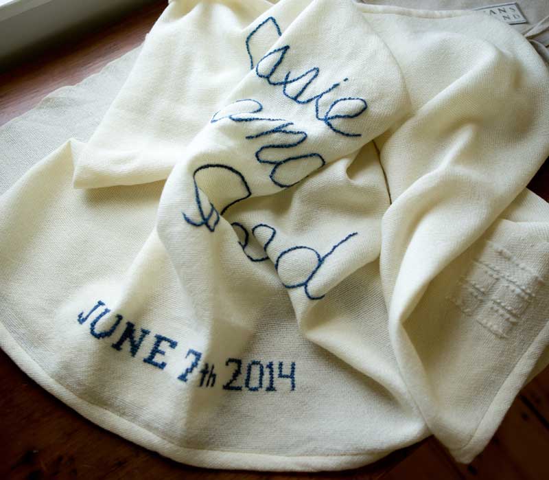 Monogrammed Boothbay Wrap - A custom-embroidered wrap commemorates special wedding date. Swans Island Company's artisans can hand-stitch your special date or names to commemorate your special occasion. Made in Maine, USA.