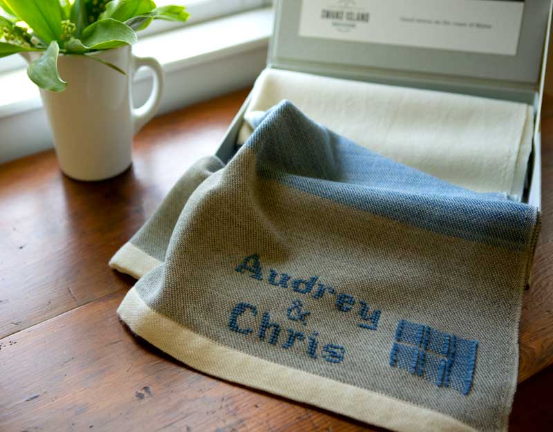 Swans Island Company provides exquisite hand-stitched customization to commemorate weddings and other special occasions. Let us make your special gift truly one--of-a-kind. Shown here is the Swans Island Maine Coast Throw, monogrammed with the bride and groom's names.