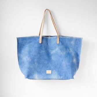 Swans Island's Hana Canvas Boat Bag by Graf Lantz - rugged tie-dyed cotton canvas with leather handles. Shown in Sky color.