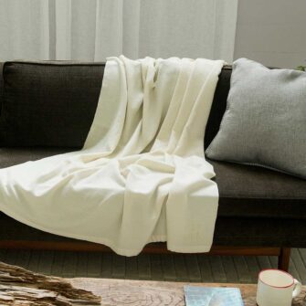 The Swans Island Solstice Throw shown in white + white