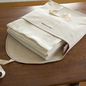 Swans Island handwoven blankets come in our custom linen storage bag with aromatic cedar slats.