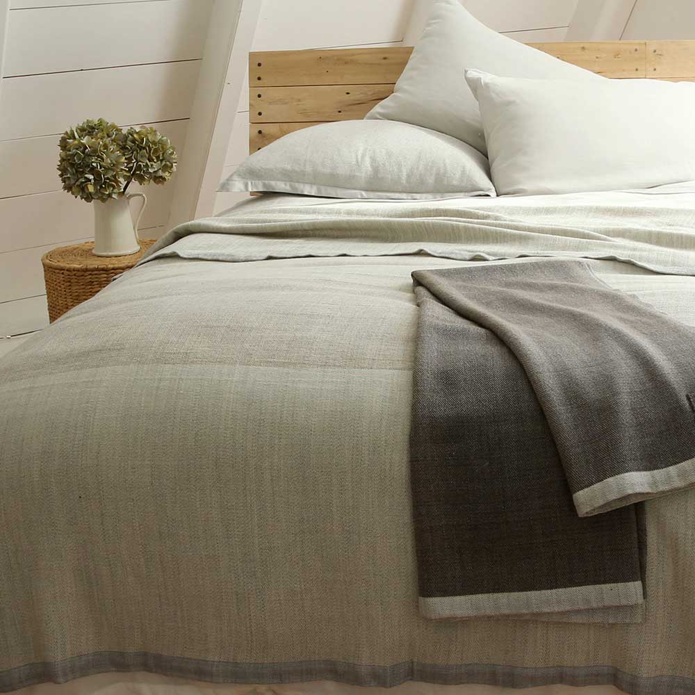 Solstice Blankets on Bed