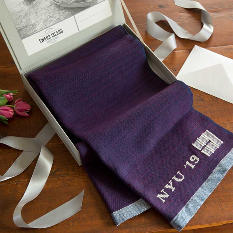 The Swans Island Katahdin Throw comes in our distinctive linen presentation box, perfect for gifting. Shown here with a custom monogram for a memorable graduation gift.