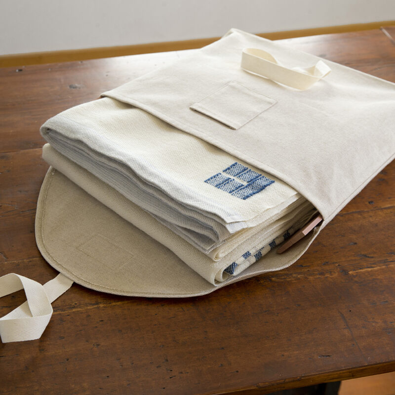 Swans Island's handwoven Grace blankets come in a custom linen storage bag with aromatic cedar slats - for safe keeping when blanket is not in use.