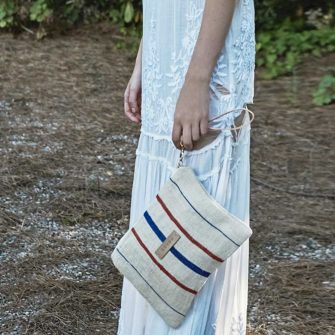 Swans Island Vintage Euro Clutch made by Gouvou with antique grain sack textiles.