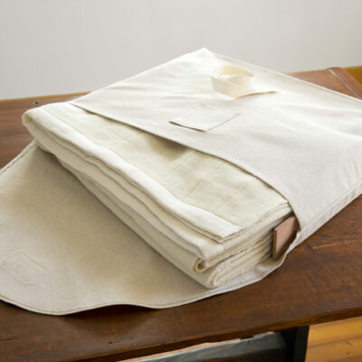 Swans Island Company's handwoven 100% wool Winter Blanket in custom linen storage bag with cedar slats