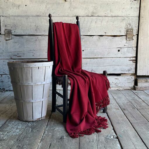 Swans Island's Summer Twill Throw in Rustic Red is woven from 100% cotton and made in USA.
