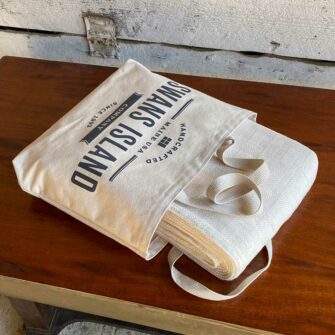 Swans Island Dover Blanket in undyed natural cotton comes in a Swans Island canvas tote bag.