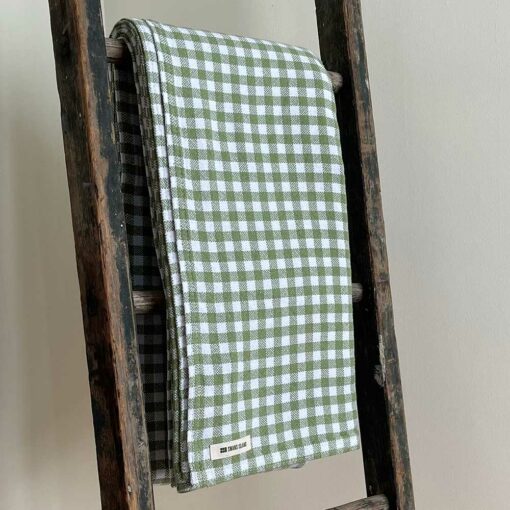 Swans Island's classic Gingham Check blanket is woven in Maine with 100% natural cotton.