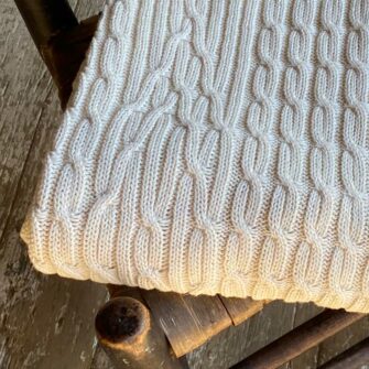 Cable Throw is knit with soft undyed American cotton. Made in USA.