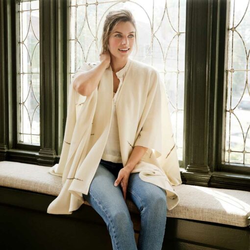 The Swans Island Whitecaps Cape is handwoven in Maine with soft merino wool with bits of textured wool reminiscent of whitecaps on the water.