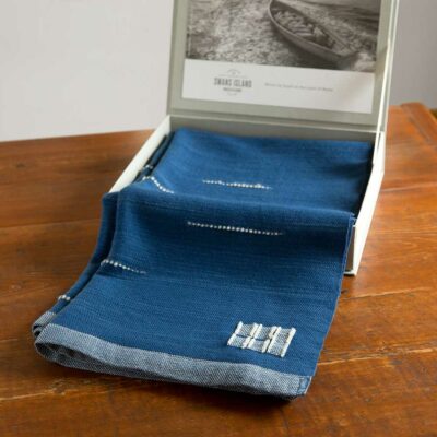 Swans Island Whitecaps Cape comes in our signature gift box. Handwoven in Maine with hand-dyed organic merino wool. Indigo with Natural. 