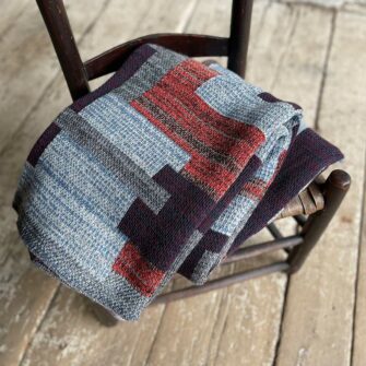 Swans Island's Artisan Patchwork Throw #201 is a one-of-a-kind knit. Made in USA this cozy oversized throw has richly marled yarns. Each one is unique.