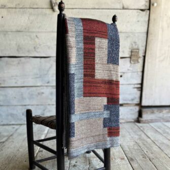 Swans Island's Artisan Patchwork Throw #212 is a one-of-a-kind knit. Made in USA this cozy oversized throw has richly marled yarns. Each one is unique.