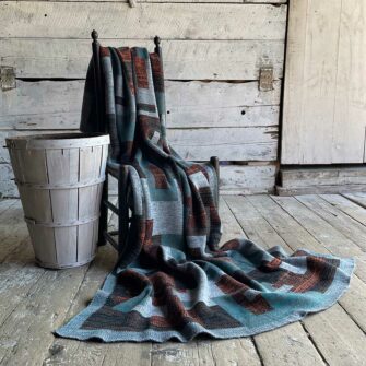 Swans Island's Artisan Patchwork Throw #215 is a one-of-a-kind knit. Made in USA this cozy oversized throw has richly marled yarns. Each one is unique.