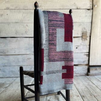 Swans Island's Artisan Patchwork Throw #219 is a one-of-a-kind knit. Made in USA this cozy oversized throw has richly marled yarns. Each one is unique.