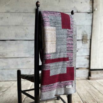 Swans Island's Artisan Patchwork Throw #220 is a one-of-a-kind knit. Made in USA this cozy oversized throw has richly marled yarns. Each one is unique.