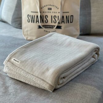 Swans Island's Belfast Herringbone Blanket is woven in Maine with 100% American cotton.