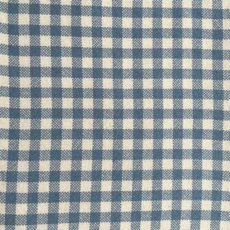 Swans Island's classic Gingham Check Throw blanket is woven in Maine with 100% natural cotton.