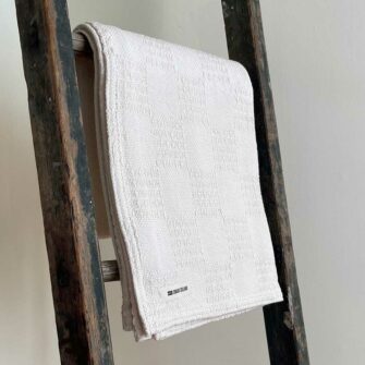 Swans Island's Madison Throw blanket is woven in Maine with 100% American cotton.