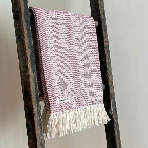 Swans Island's Savannah Throw blanket is woven in Maine with 100% American cotton and features a hand-tied fringe.