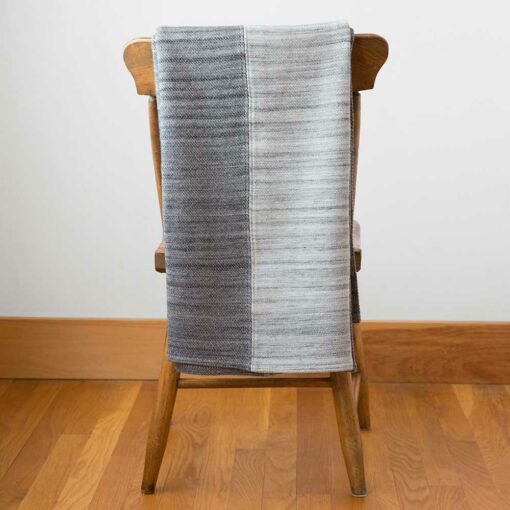 Swans Island's Acadia Patchwork Throw. Upcycled organic merino wool and cotton, made in Maine USA. Graphite/Pewter/Graphite Colorway.