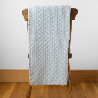 Swans Island Cotton Toddler Blanket - Knit basketweave texture, generously sized for toddlers. 100% Pima cotton made in USA. Shown in Light Blue.