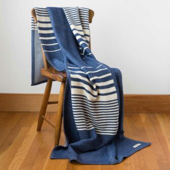 Swans Island's Up-cycled Penobscot Patchwork Throw. Upcycled organic merino wool and cotton, made in Maine USA. Nautical Blue + White Colorway.