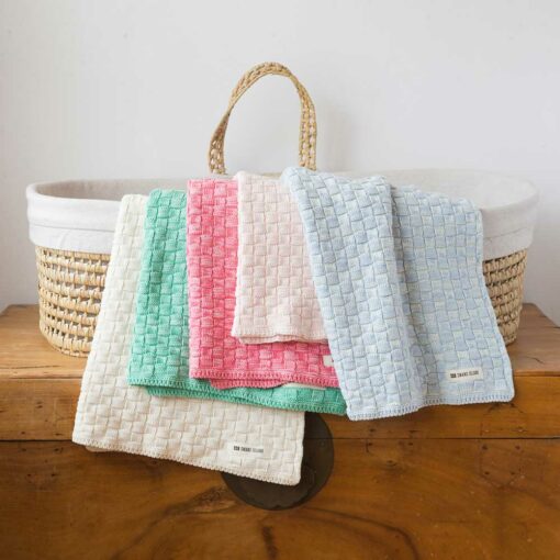 Swans Island Cotton Basketweave Baby Blanket. Knit in USA. Shown in Natural, Pistachio, Coral, Light Pink, Light Blue