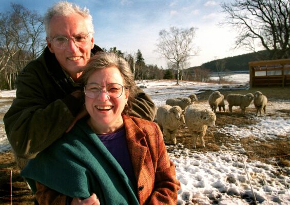 John and Carolyn Grace, founders of Swans Island Company, with a flock of sheep in 1992.