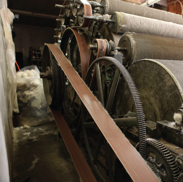 Vintage machinery at the Green Mountain Spinnery in Vermont - turning wool fleece into custom-spun yarn for Swans Island handwoven blankets.