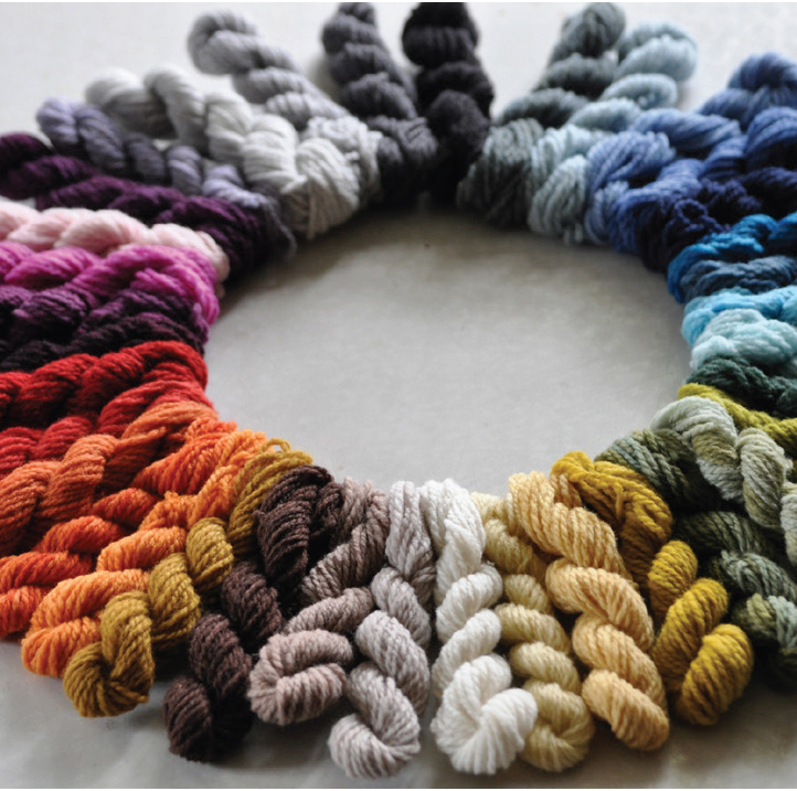 Sample skeins of wool yarn create a rainbow of hand-dyed colors at the Swans Island Co. dyehouse.