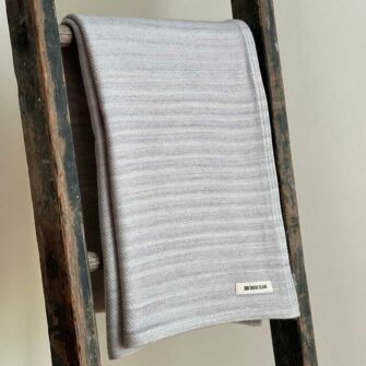 Swans Island's Acadia Throw blanket is woven in the USA with Certified Organic Washable Merino Wool and Organic American Cotton.