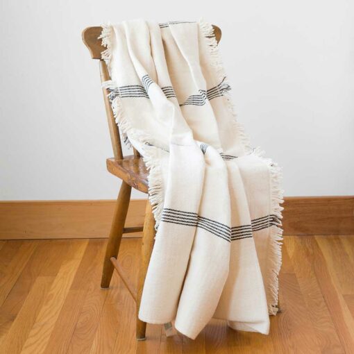 Swans Island - Poyvi Throw by Under the Bough, rustic cotton handwoven in Paraguay. Shown in Natural + Black.