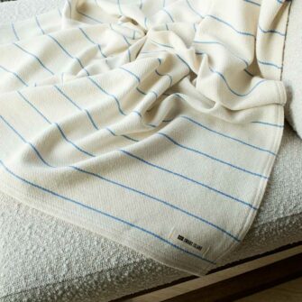 Swans Island Cotton Pinstripe Throw. Made in Maine with hand-dyed USA cotton. Natural + French Blue