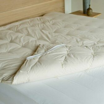 Swans Island Wool Mattress Topper is made in the USA with climate beneficial wool fill.