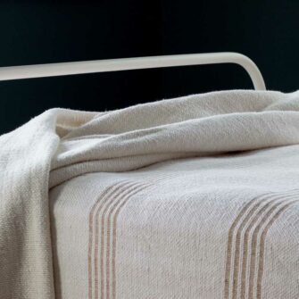 Swans Island - Poyvi Blanket by Under the Bough, rustic cotton handwoven in Paraguay. Shown in Natural + Sand