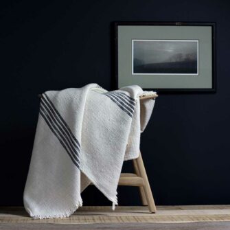 Swans Island - Poyvi Throw by Under the Bough, rustic cotton handwoven in Paraguay. Shown in Natural + Black.